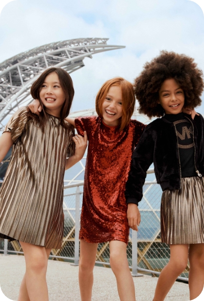 Kids’ fashion trends for Autumn-Winter 22/23 gold and sequin dress Michael Kors